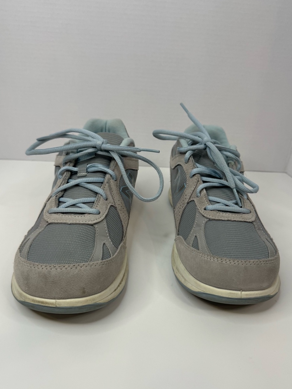 New Balance Light Gray Sneakers with Pale Blue Accents